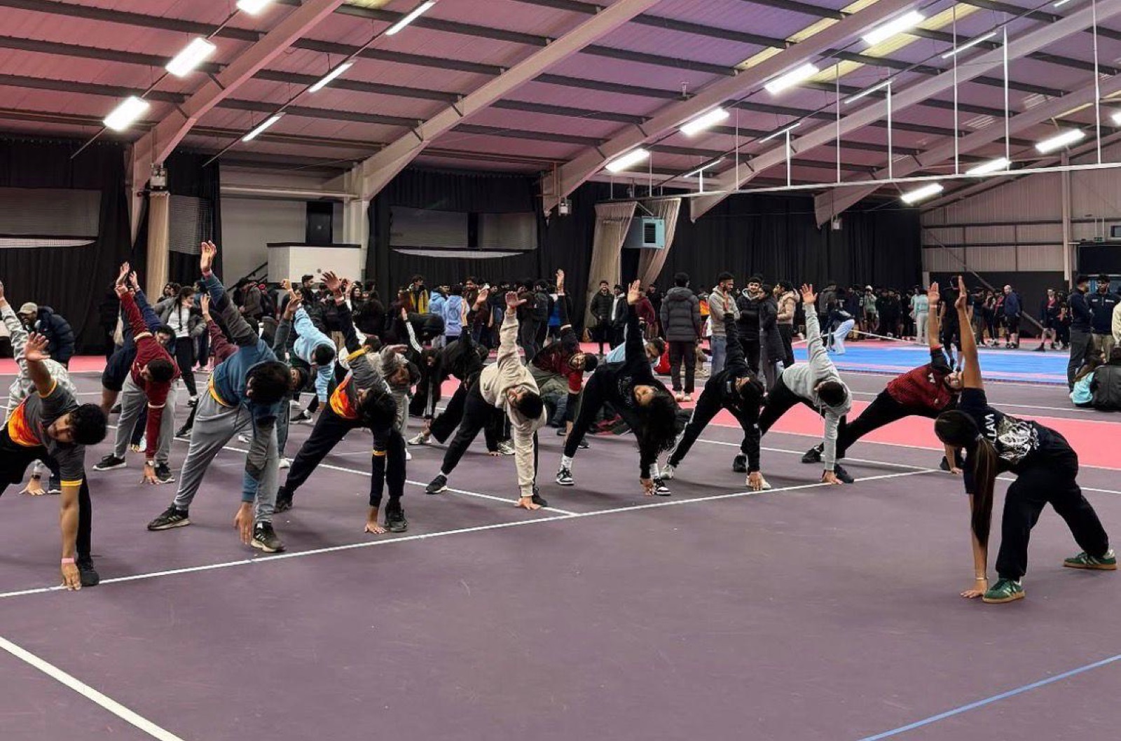 Leading a large indoor yoga class