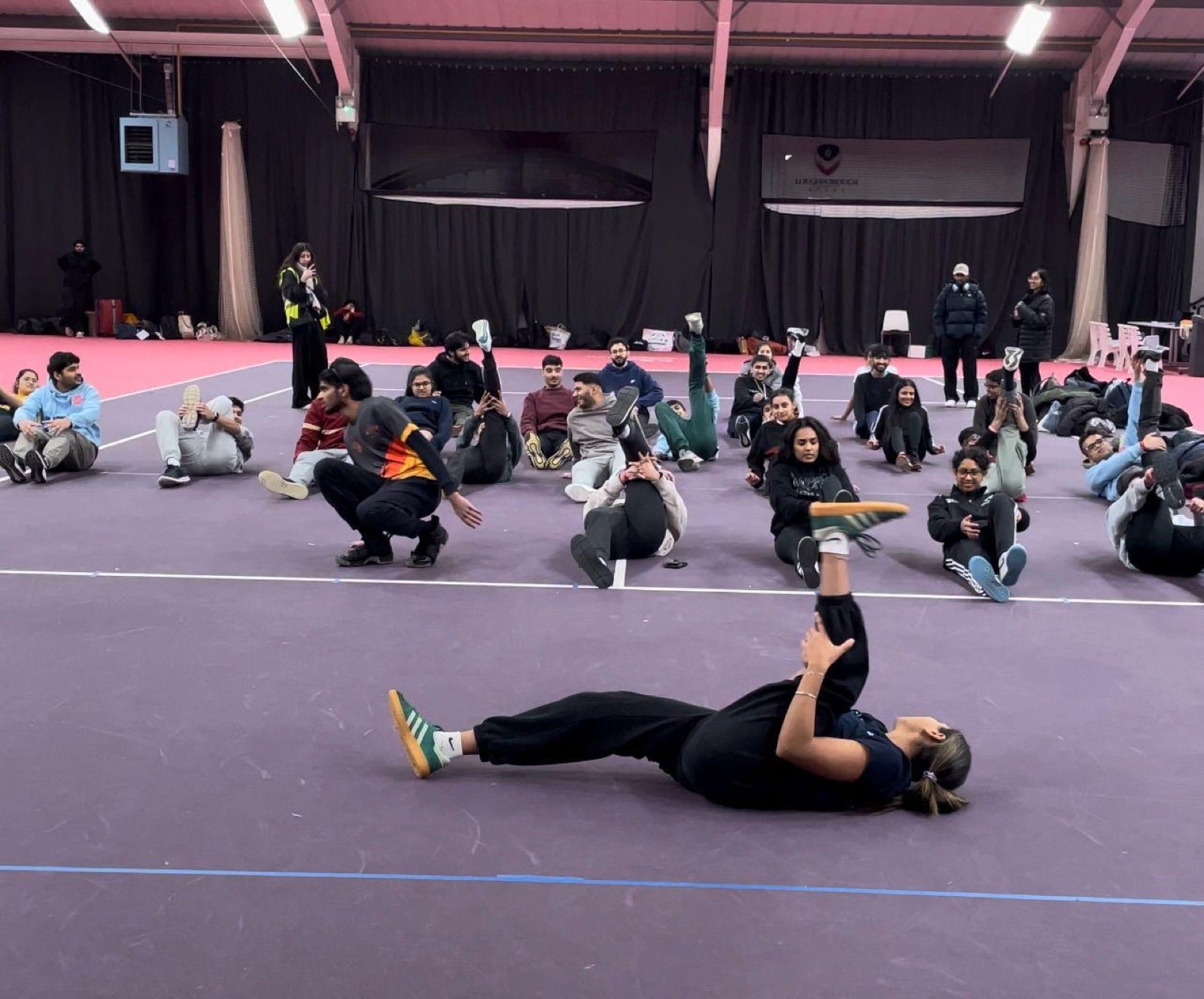 Demonstrating a supine twist to a class