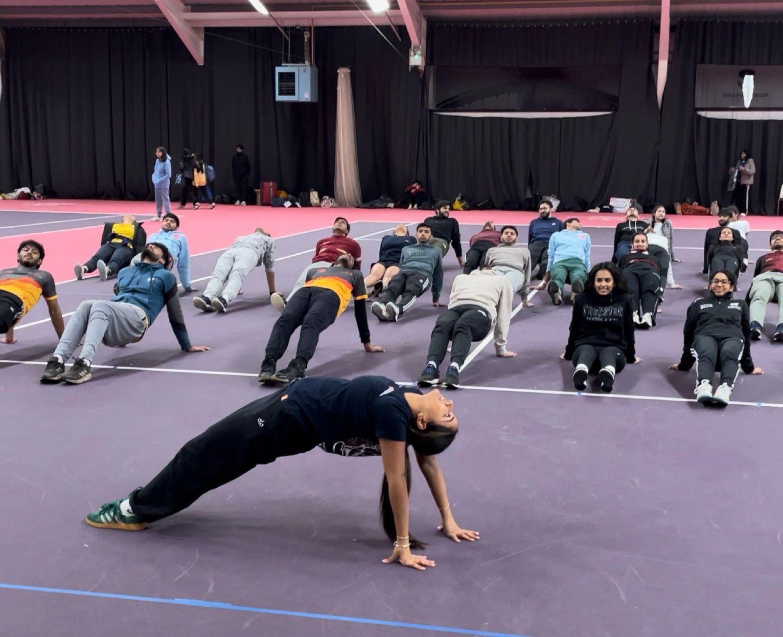 Teaching plank pose to a large group